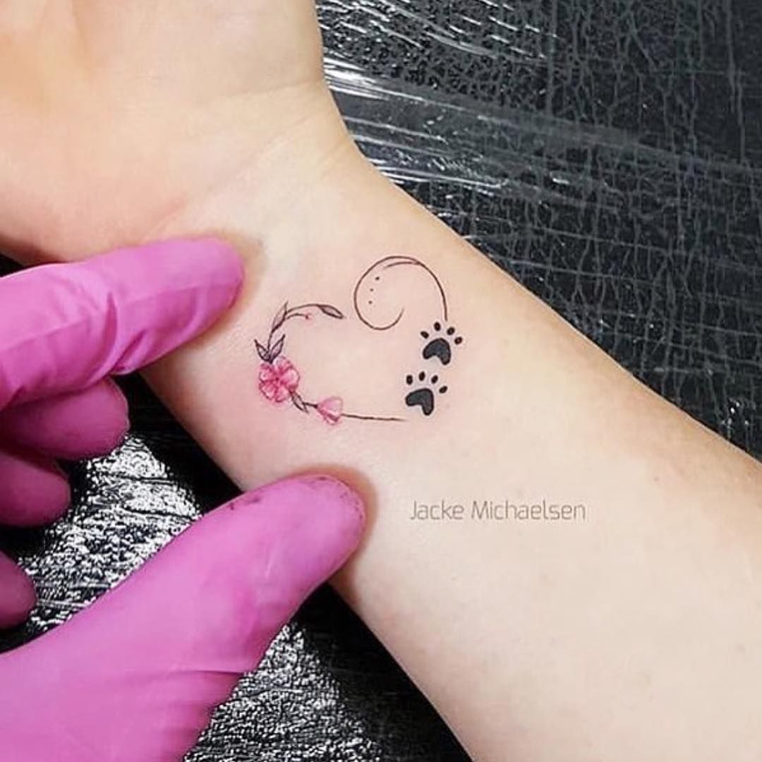 11 Most Beautiful Paw Print Tattoos Ideas Pawprint Tattoo Infinity