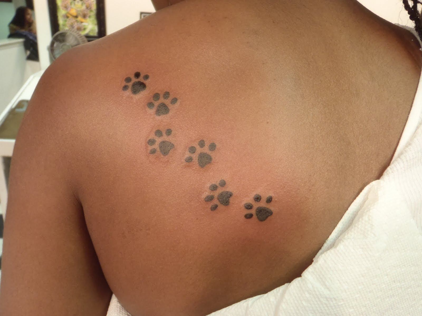 20 Amazing Paw Print Tattoos With Deep Connection Tattooswin Pawprint Tattoo Cat Paw