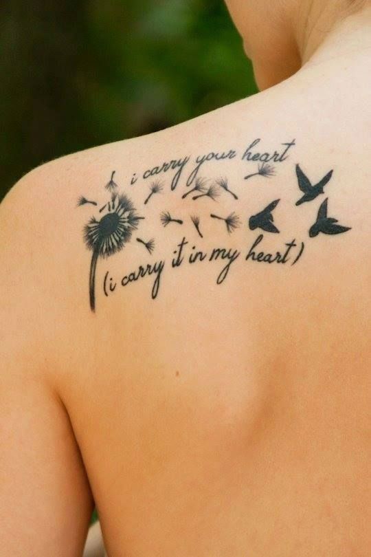 A Woman S Back With A Dandelion Tattoo On Her Left Shoulder And Two