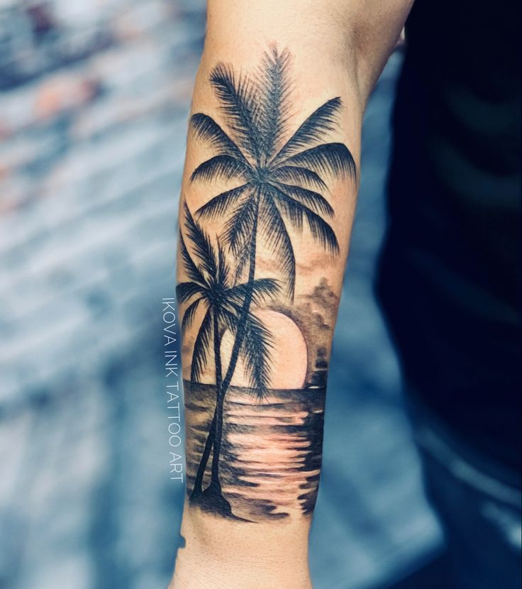 A Woman S Thigh With A Sunset And Palm Trees Tattoo