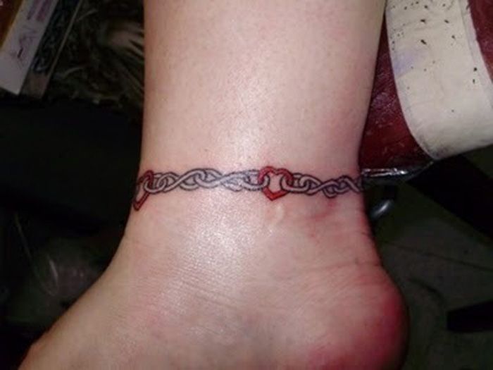 Ankle Tattoo Of A Chain With A Crown By Murat Bilek