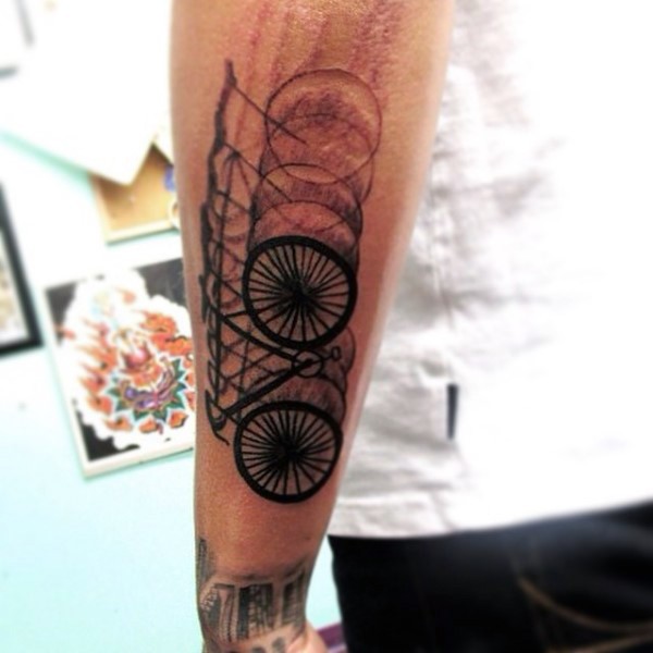 Awesome Black Ink Blur Like Bicycle Tattoo On Arm Tattooimages Biz