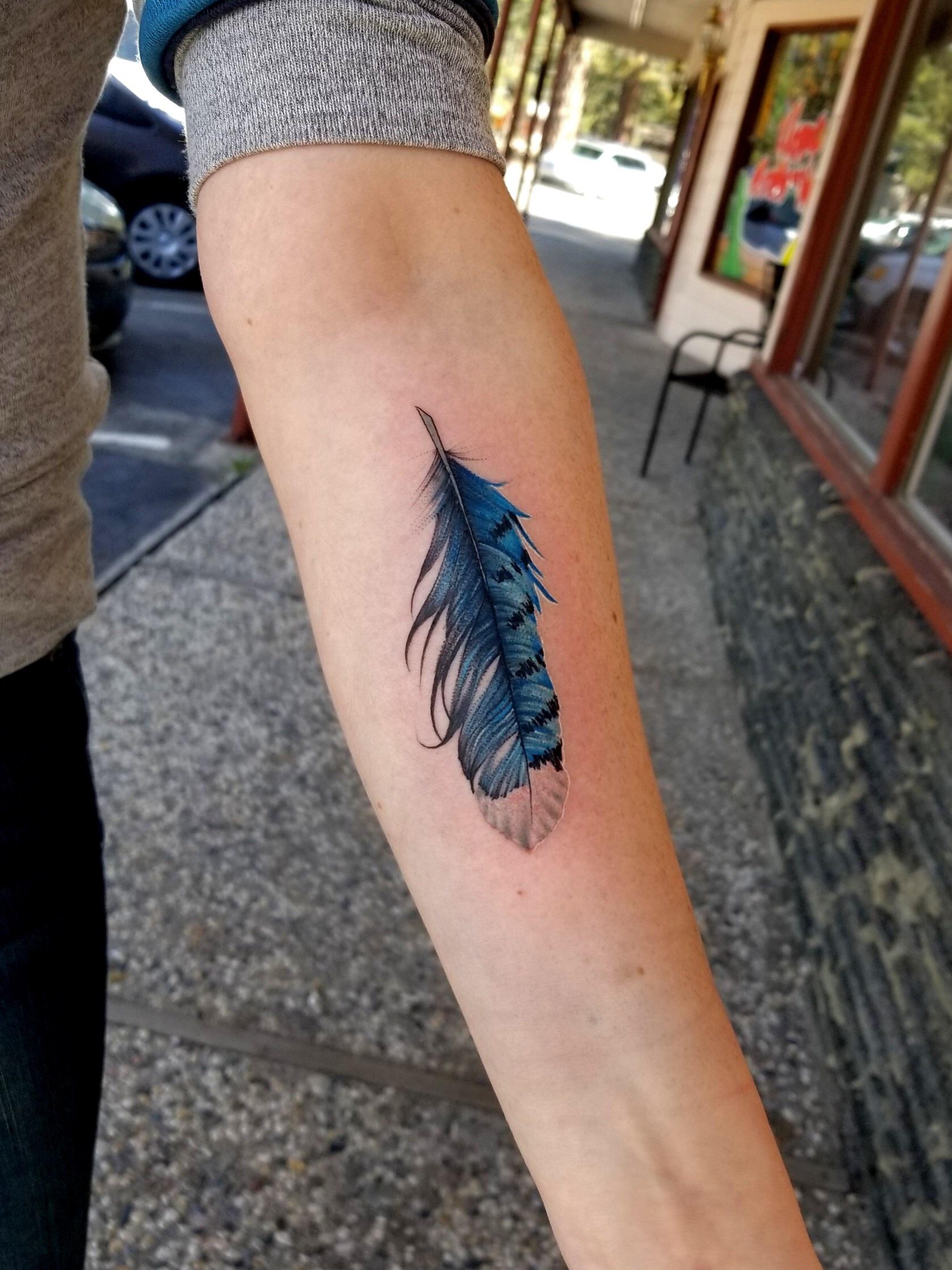 Blue Jay Feather Tattoo: Symbolism and Elegance