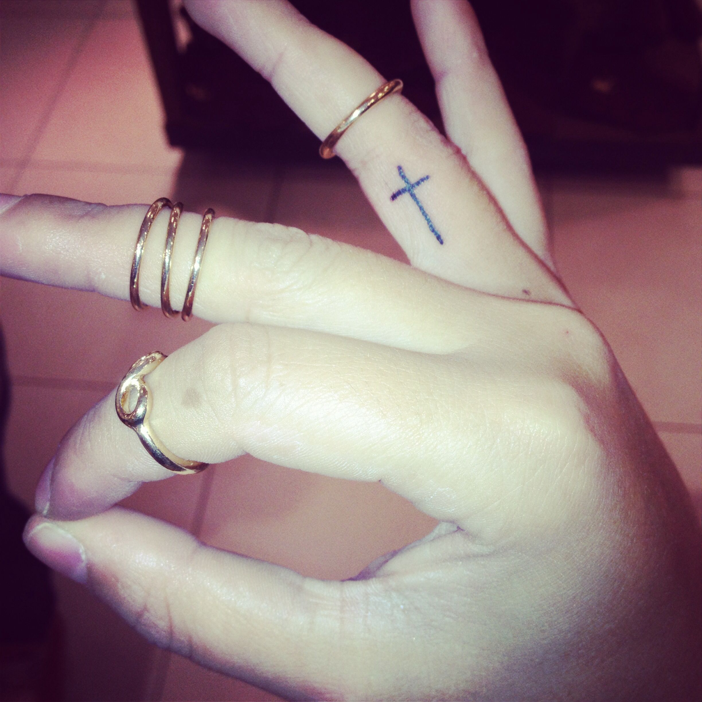 5 Stylish Finger Tattoo Designs for Cross Lovers