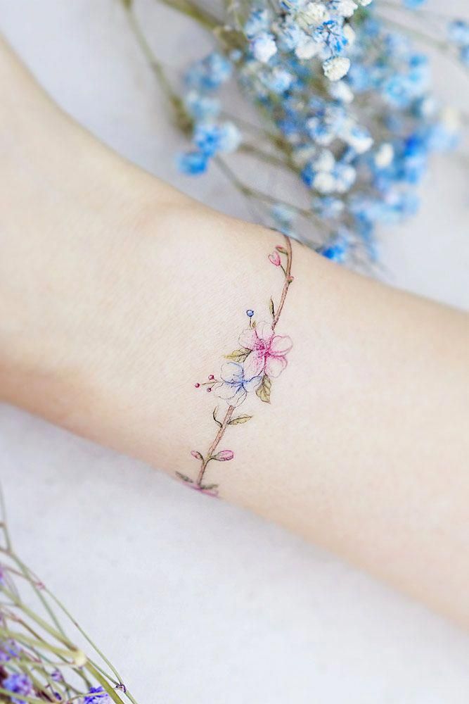 Elegant and Subtle Delicate Flower Wrist Tattoos