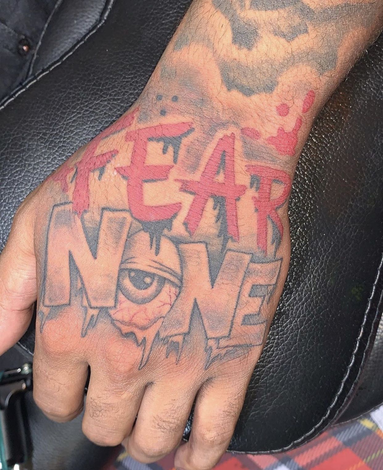 5 Bold Meanings Behind Fear None Hand Tattoos