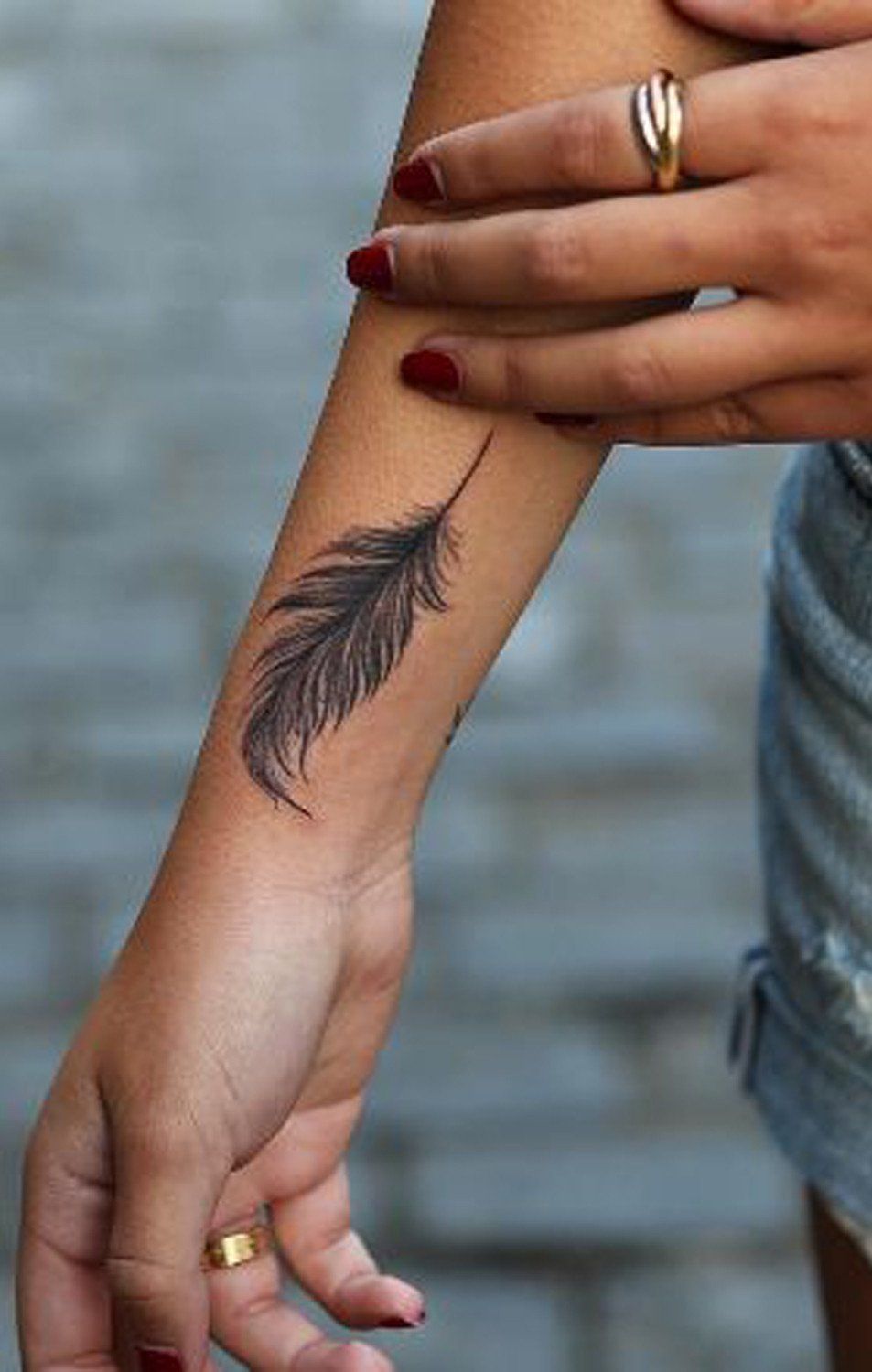 Feather Tattoo on Arm: Meaning and Design Ideas