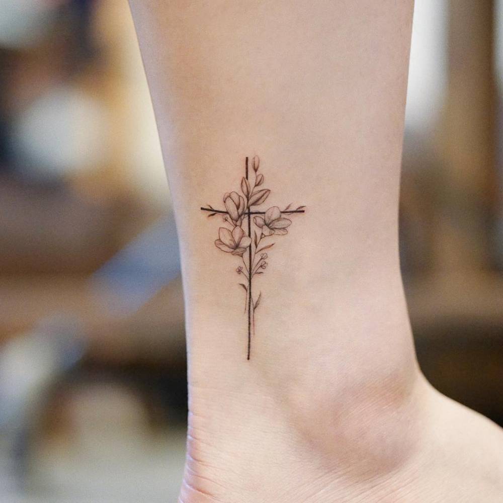 Fine Line Floral Cross Tattoo On The Inner Arm