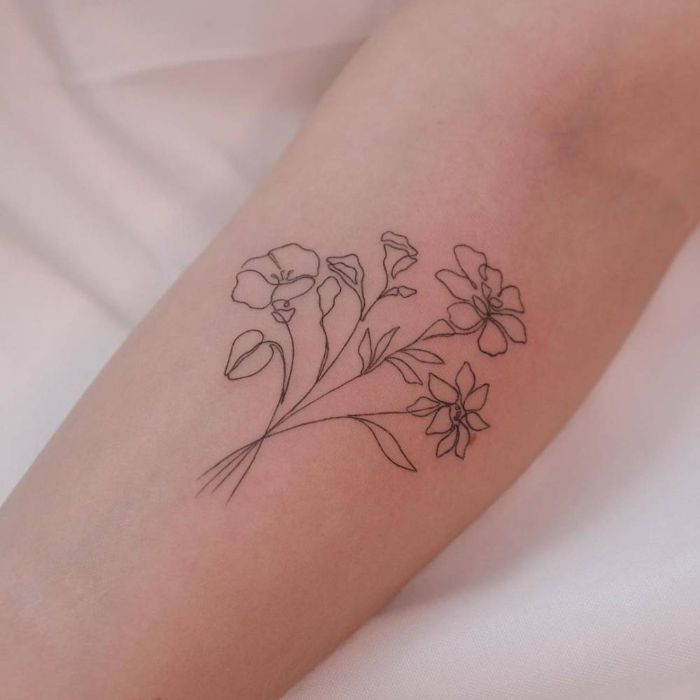 Fine Line Flower Bouquet Tattoo On The Upper Arm