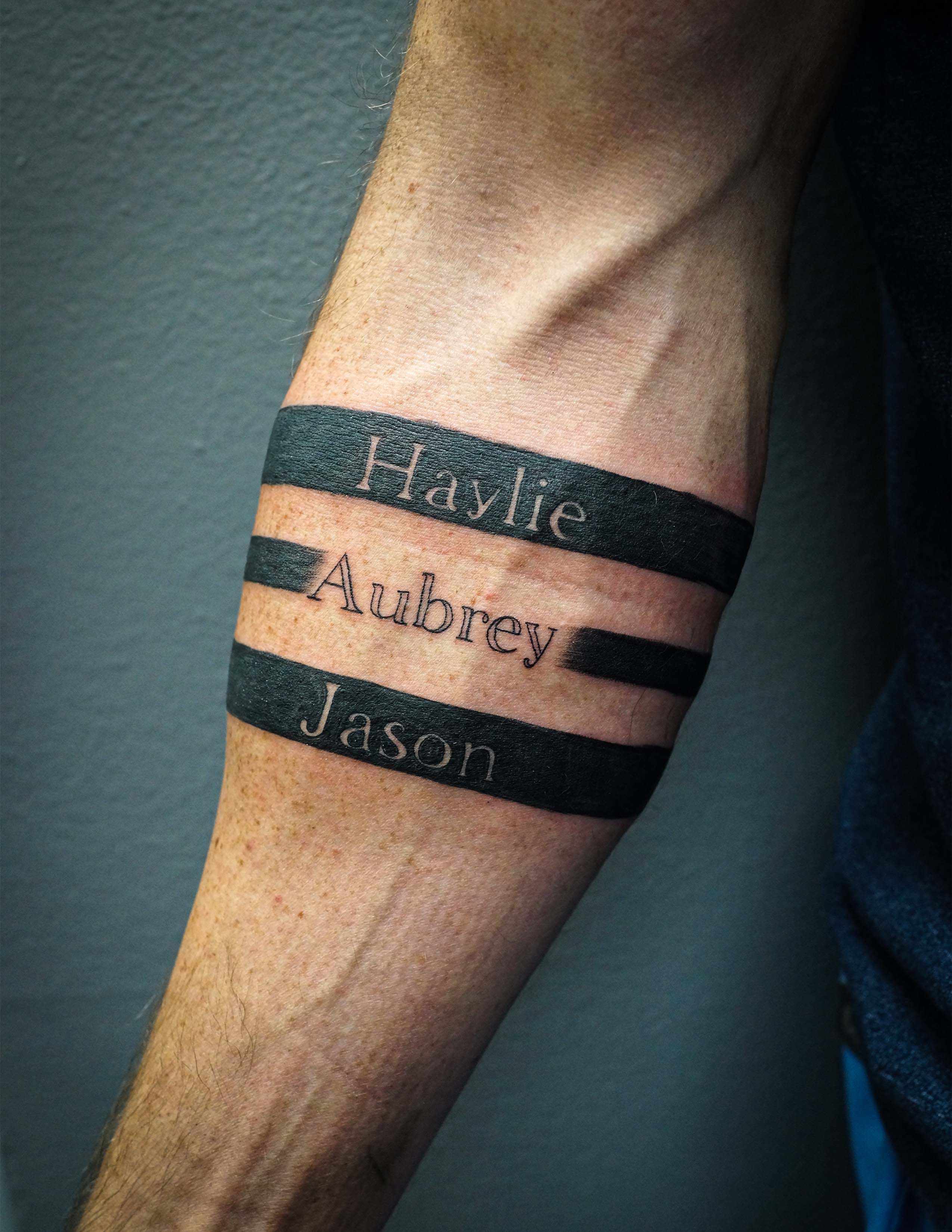 10 Stunning Forearm Band Tattoo Ideas for Men