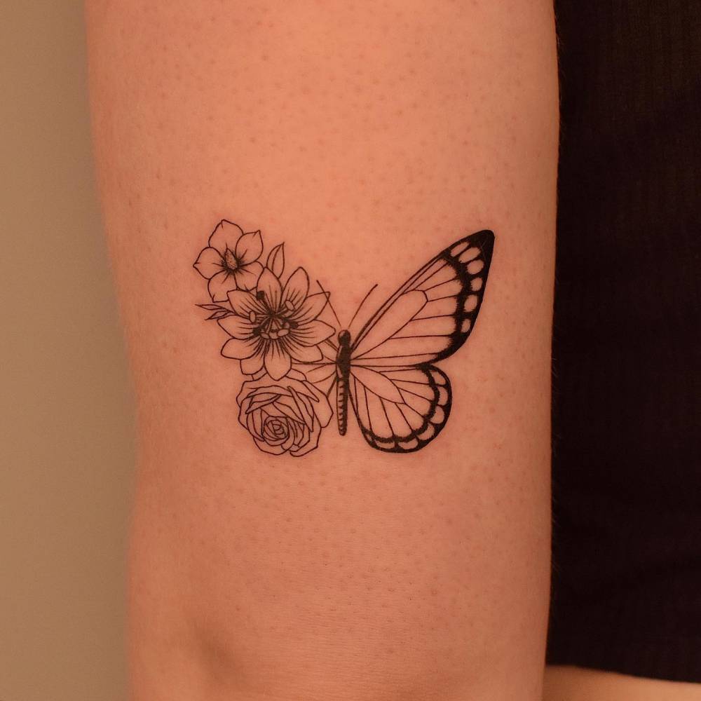 Half Butterfly Half Flower Tattoo Located On The