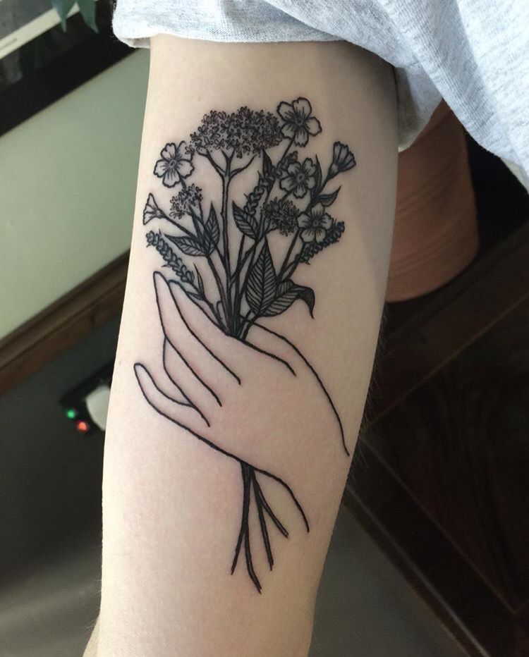 Hand Holding Flowers Tattoo: Symbolism and Style Guide