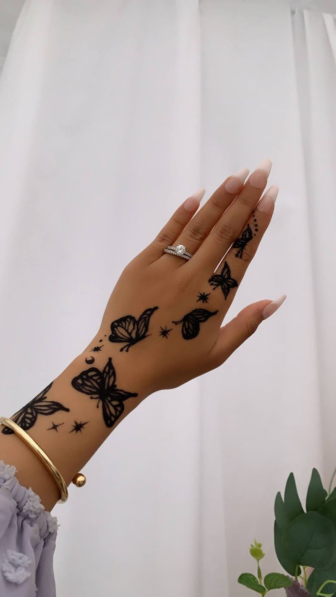 Hand Tattoos For Women 50 Beautiful Hand Tattoo Designs