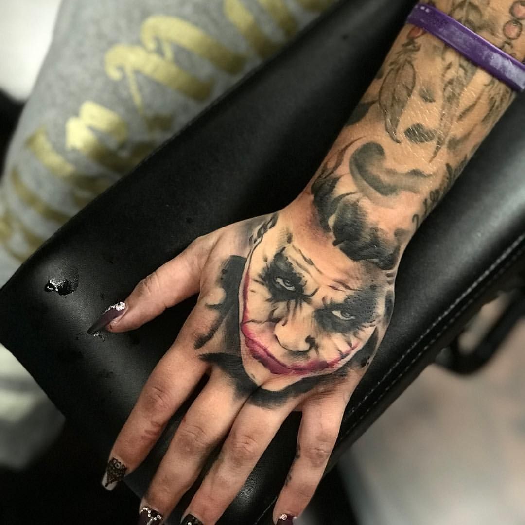 Joker Face Tattoo On Hand A Bold Statement Or Regrettable Mistake