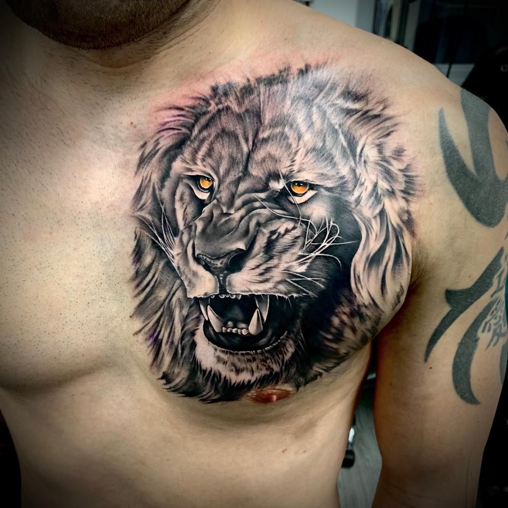 Majestic Lion Tattoos: Bold Chest Ink Ideas