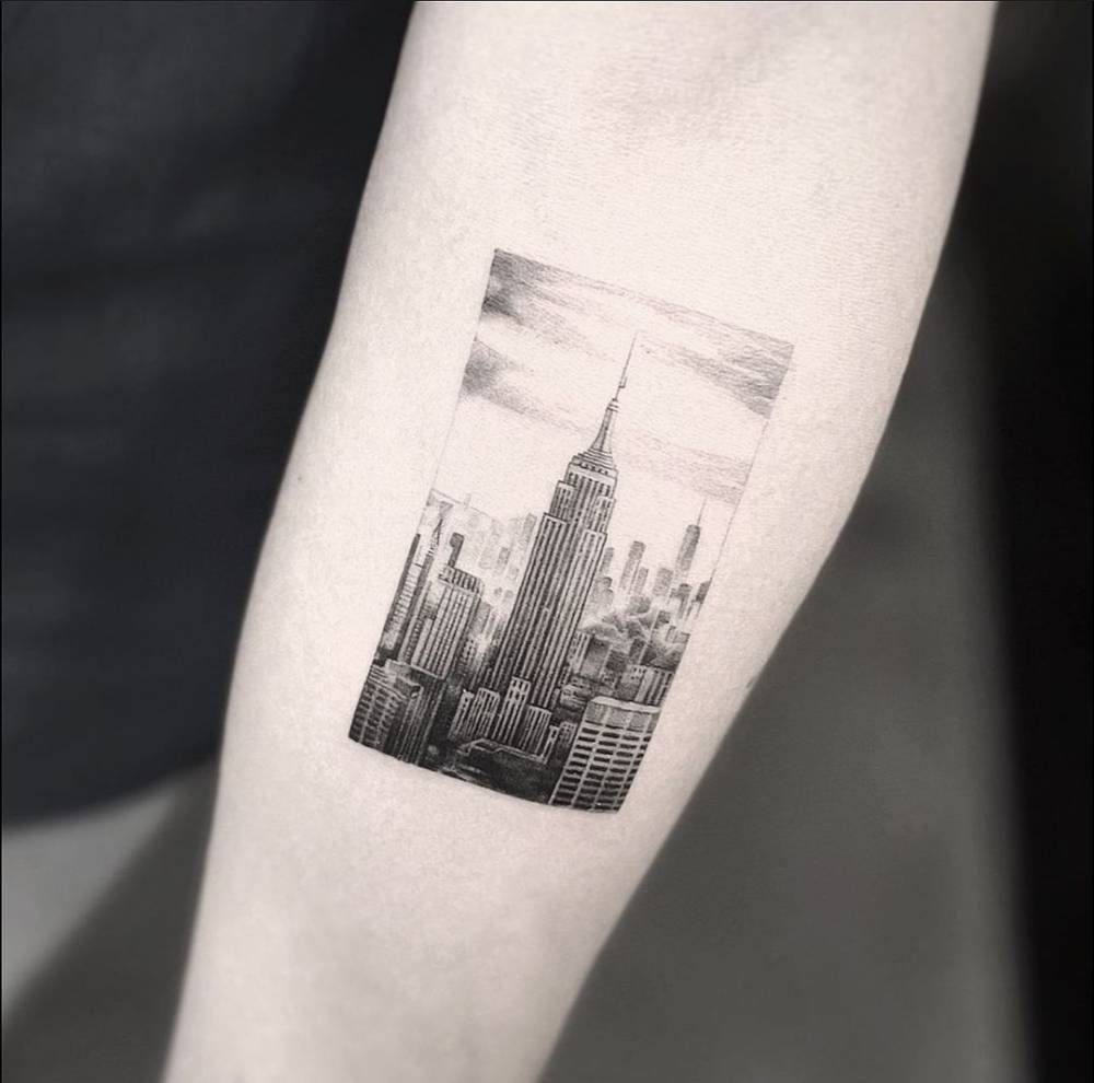 Micro Realistic New York Skyline Tattoo Located On The