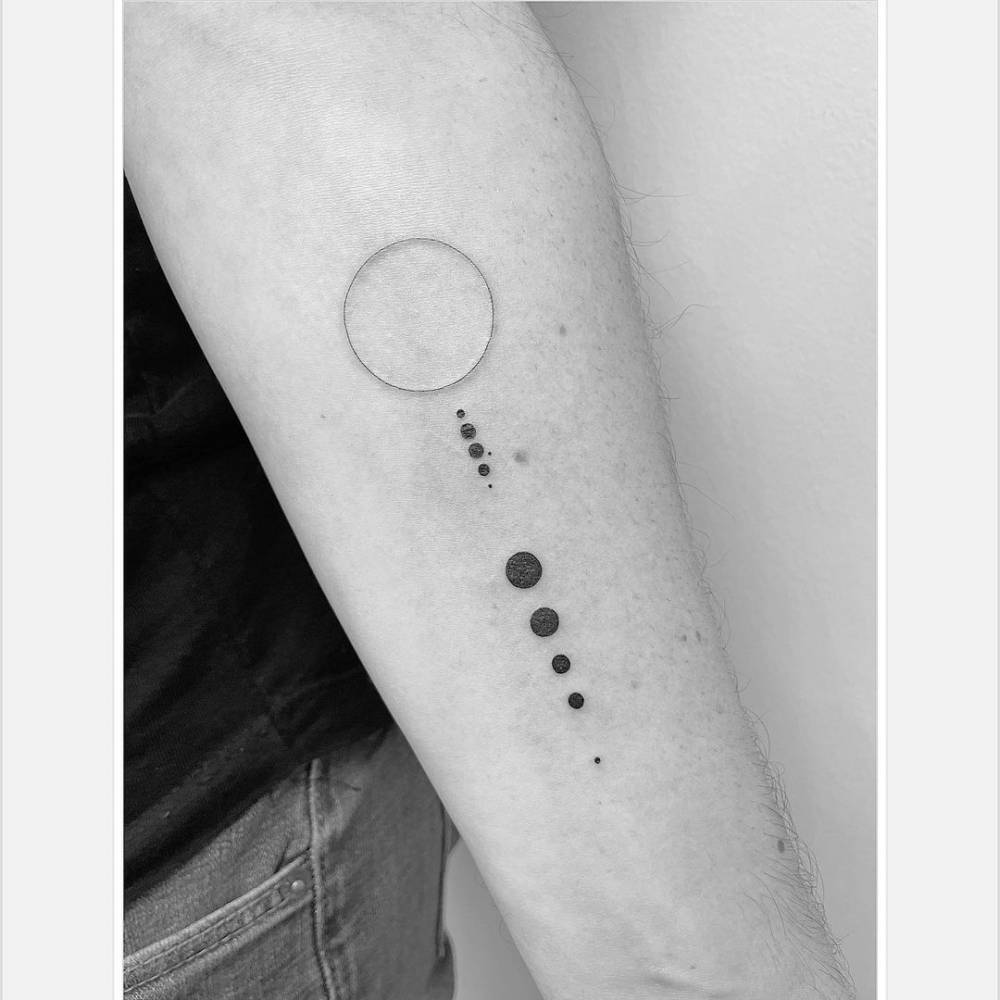 Minimalist Solar System Tattoo On The Inner Forearm