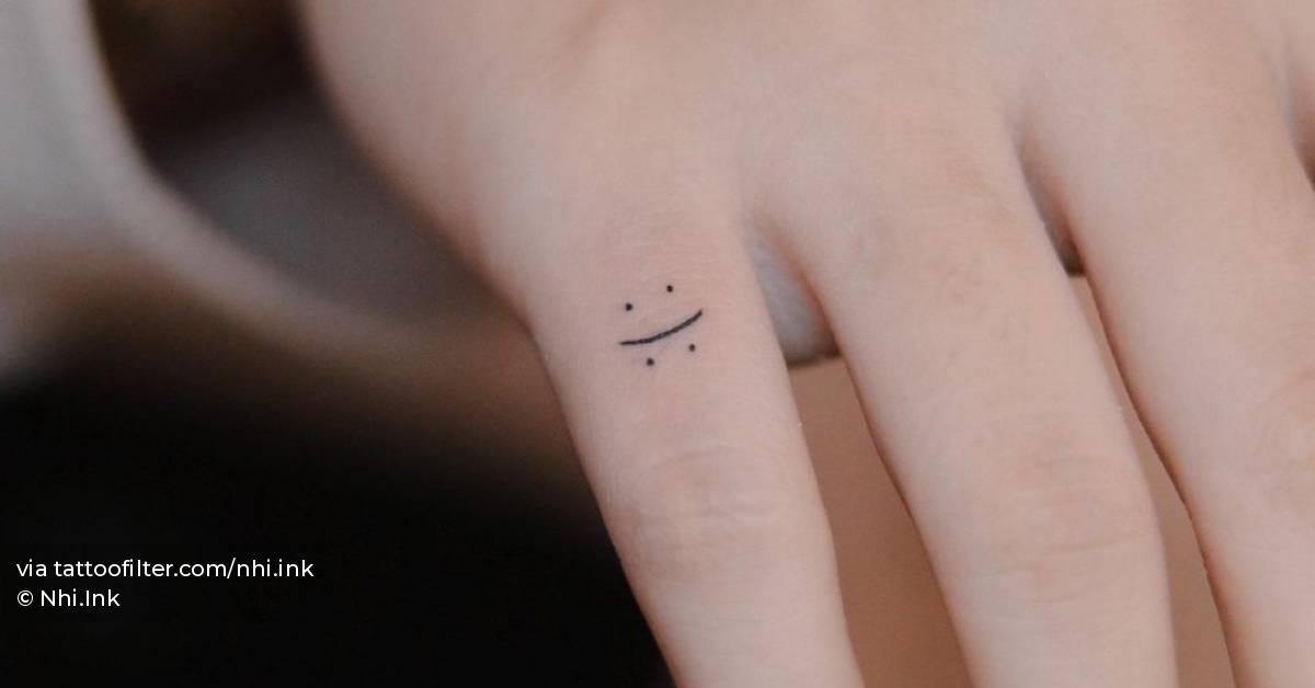 Minimalistic Happy Sad Face Tattoo Done On The Finger