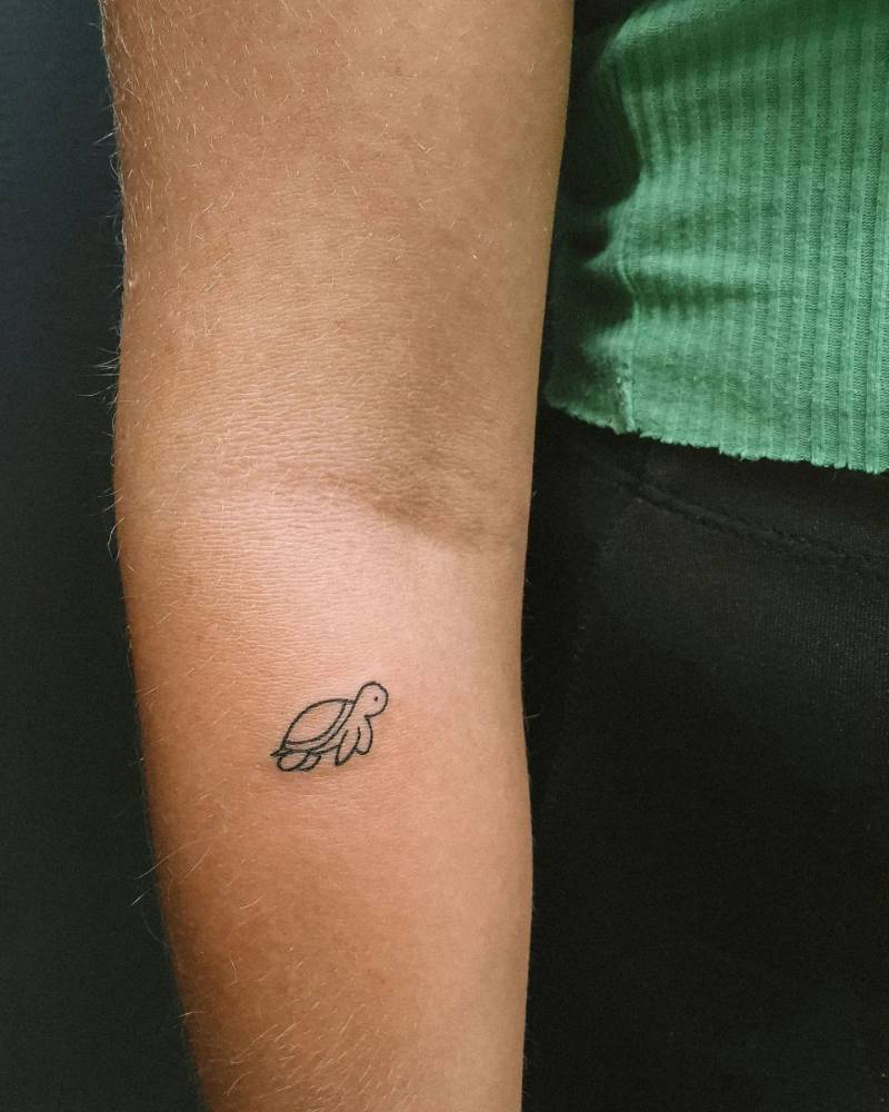 Minimalistic Turtle Tattoo Located On The Forearm