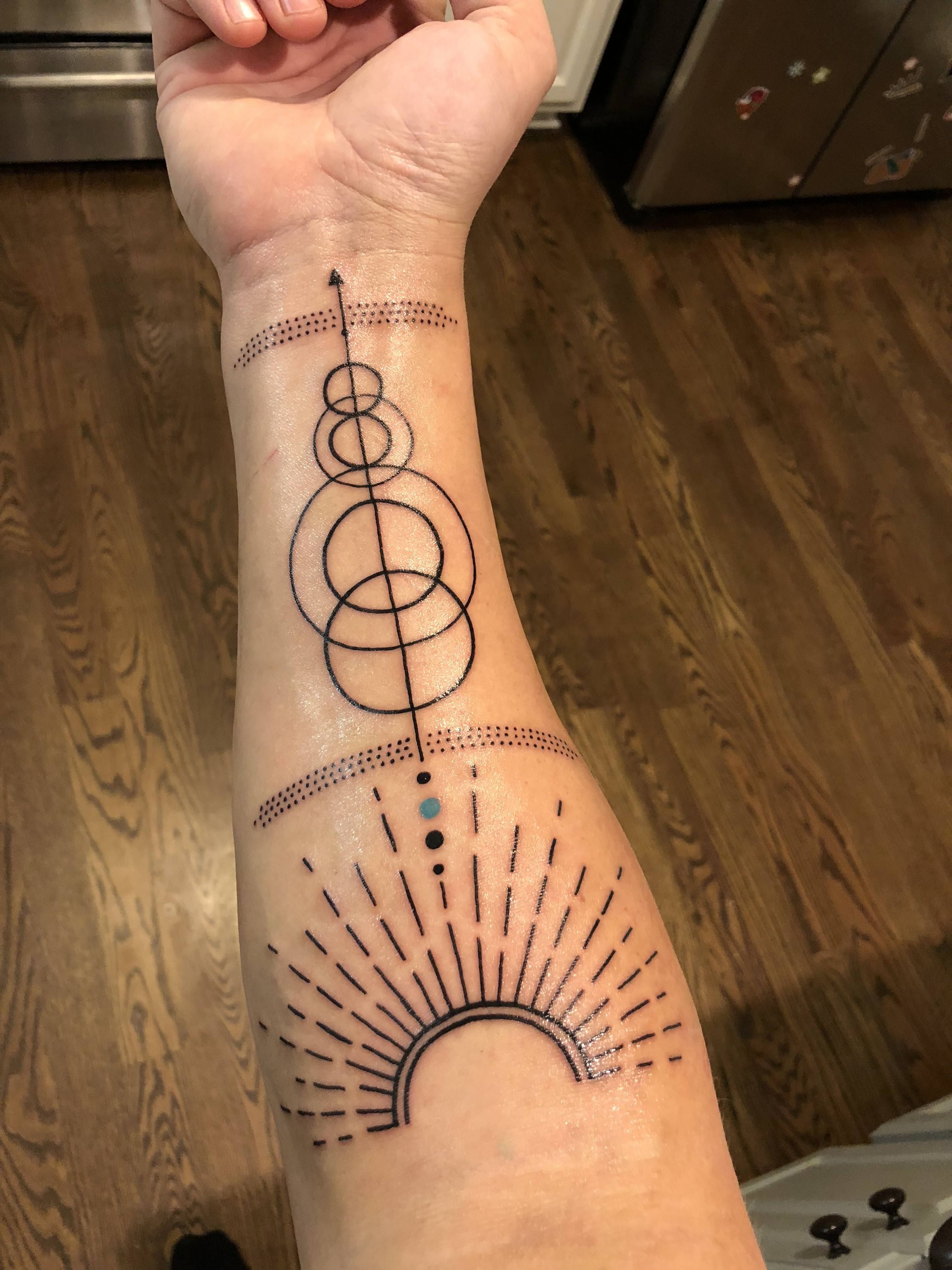 Discover the Cosmic Meaning Behind a Pale Blue Dot Tattoo