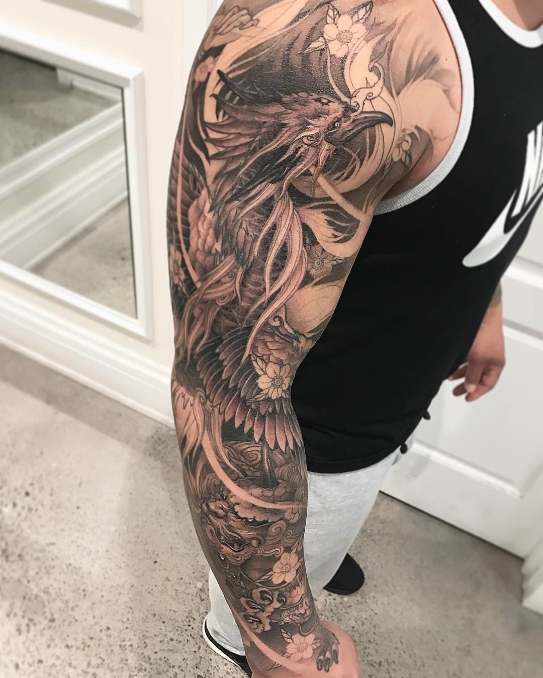 Phoenix Bird Tattoo Sleeve: Mythical Ink Masterpiece