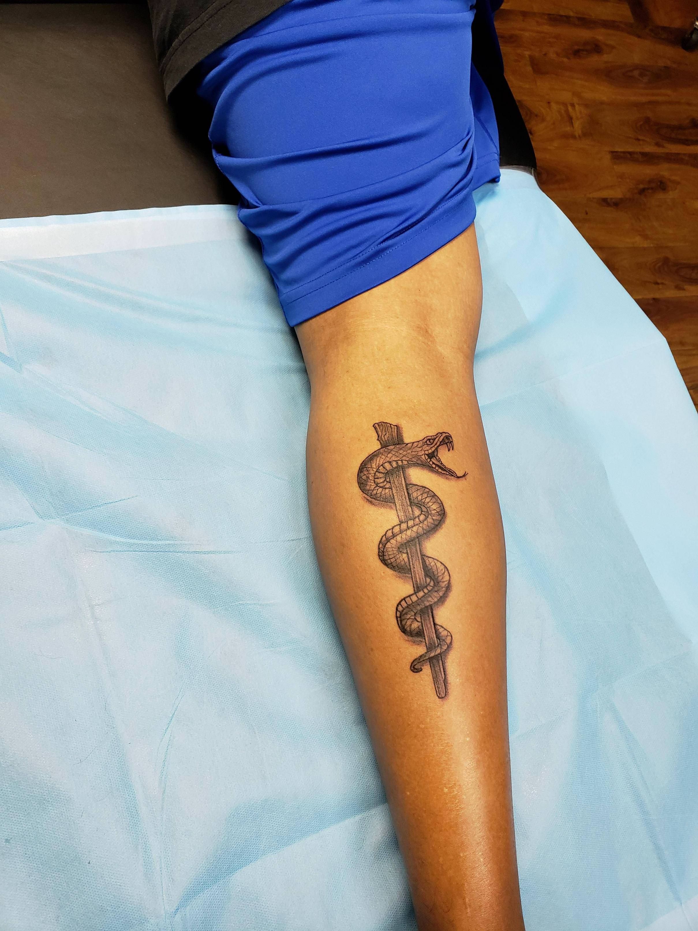 5 Symbolic Meanings Behind Rod Of Asclepius Tattoo