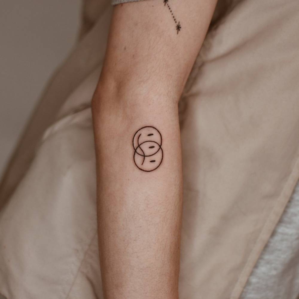 5 Meanings Behind Sad Happy Face Tattoos