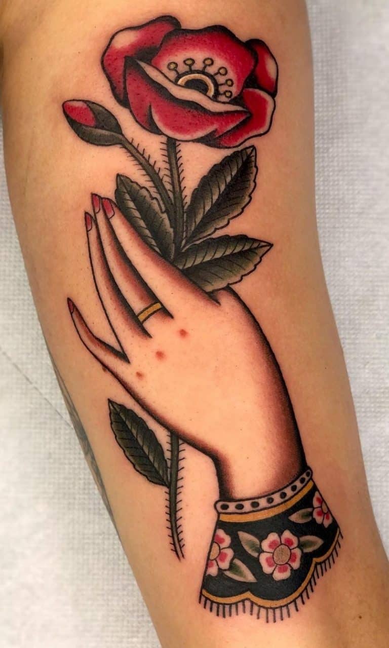 Traditional Hand Holding Flowers Tattoo By Kaicasper Hands Holding